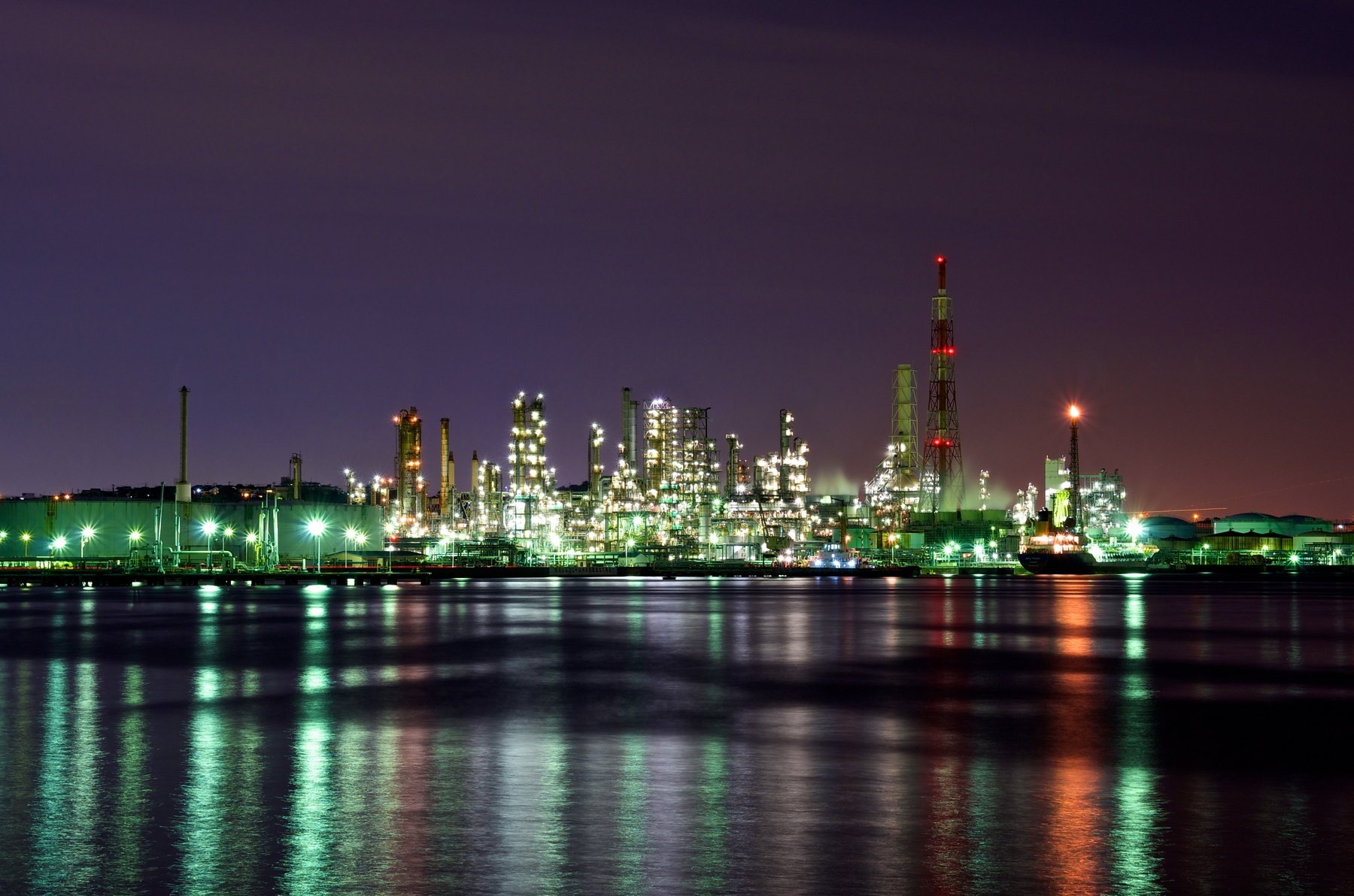 Oil refinery illuminated at night